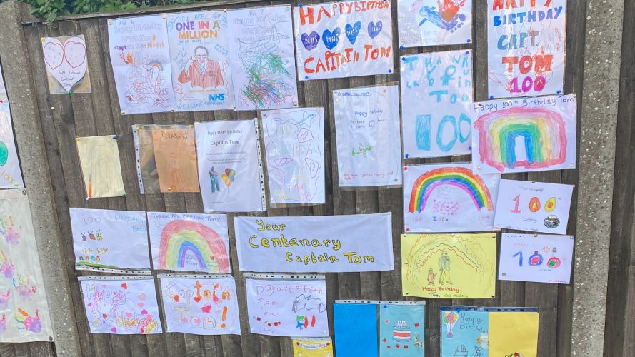 Children in Captain Tom Moore's village have been drawing birthday cards and messages for his 100th birthday.