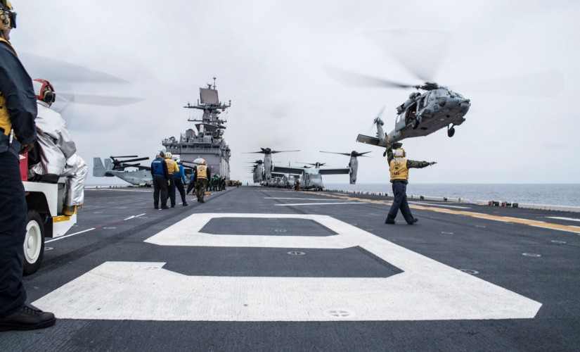 Aviation Boatswain's Mate Directs An MH-60S Knighthawk 