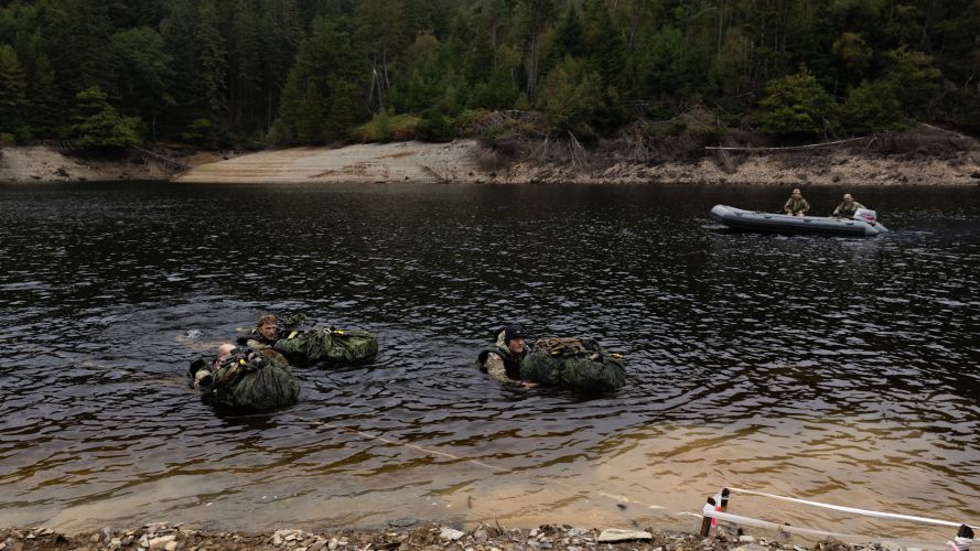 Soldiers from the Bornholm Regiment in Denmark complete a river crossing of the River Towy (Picture: MOD) Bornholm Regiment Denmark river crossing scenario Exercise Cambrian Patrol 2026 Breacon Beacons 051026 CREDIT MOD