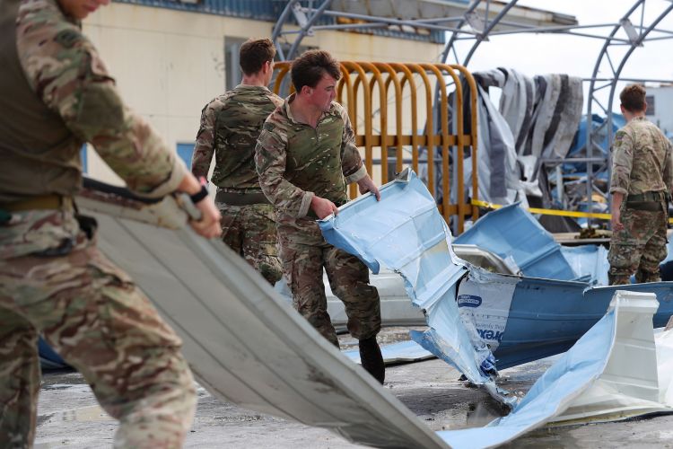 British soldiers from the Humanitarian and Disaster Relief team from RFA Mounts Bay provide assistance in Great Abaco, Bahamas, after Hurricane Dorian CREDIT MOD 040919