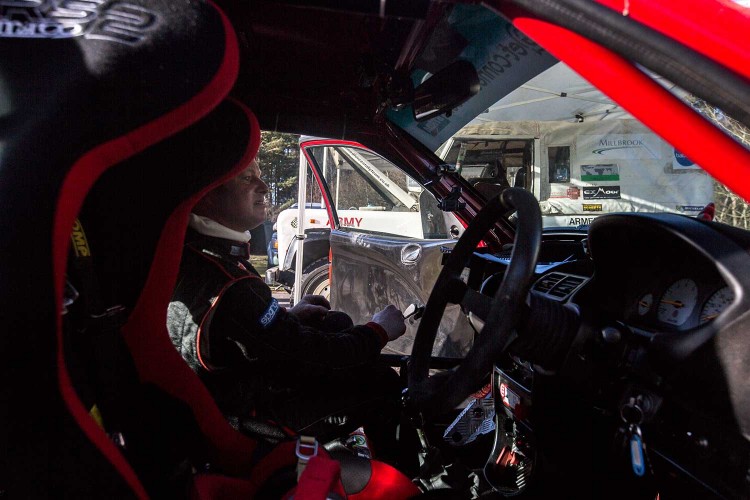 A more experienced member of the rally team takes a relaxing seat in the MG-ZR after a thrilling circuit.