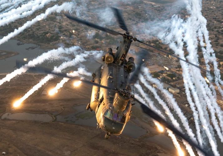 An RAF Chinook releases its flares as part of a system test in Mali (Picture: MOD). A Chinook releases its flares as part of a system test in Mali