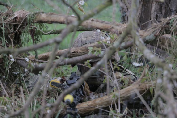 Soldier shows off his camouflage.  