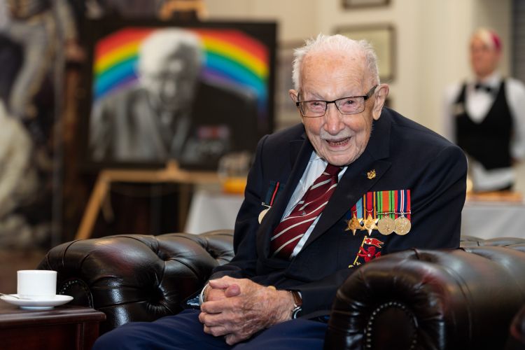 He was pictured with his portrait behind him during the visit (Picture: MOD).