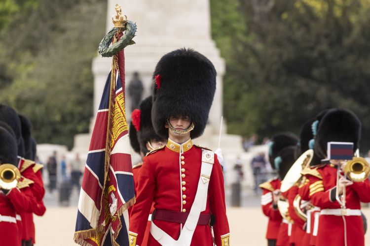 Coldstream Guards wearing Summer Guard Order military uniform scarlet and bearskin cap during Chief of Staff of US Army visit to London Whitehall 120422 CREDIT UK MOD © Crown copyright 2022