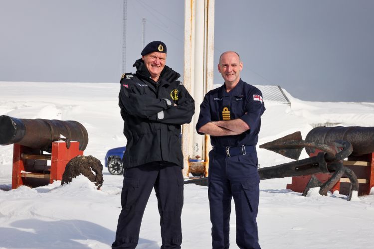 Commander Thor Straten (left) and Captain Steve Higham (right) stand in the snow on Arctic island of Jan Mayen 130422 CREDIT Royal Navy