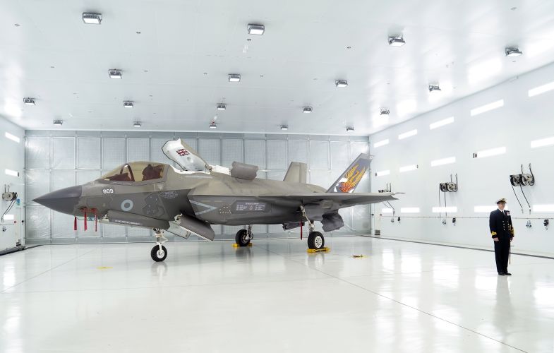 Commanding Officer of 809 Naval Air Squadron Commander Nick Smith with an F-35 Lightning jet during the commissioing ceremony at RAF Marham in King's Lynn in Norfolk (Picture: PA Wire, PA Images).