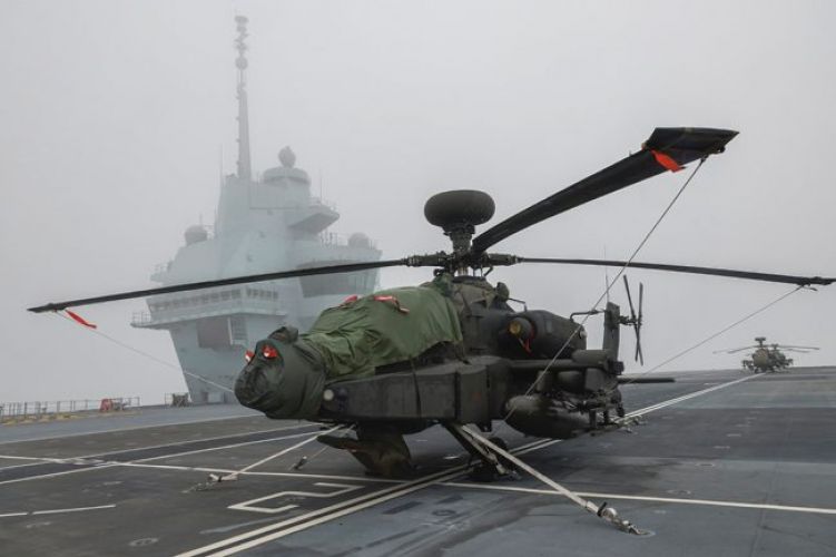 Army Air Corps Apache helicopters working with HMS Prince of Wales after joining the carrier in Portsmouth for trials (Picture: MOD).