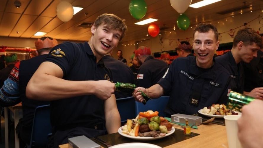 Crew Christmas lunch on board HMS Queen Elizabeth (Picture: HMS QE Twitter). Crew Christmas lunch onboard HMS Queen Elizabeth, 5 deck filled with decorations 06122021 CREDIT HMS QE Twitter.jpg