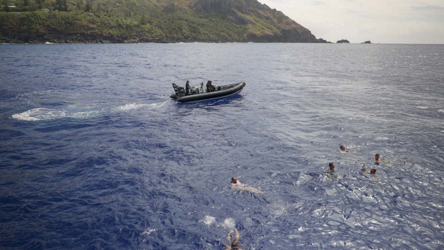 Crew enjoy a dip while the ship is anchored at Bounty Bay