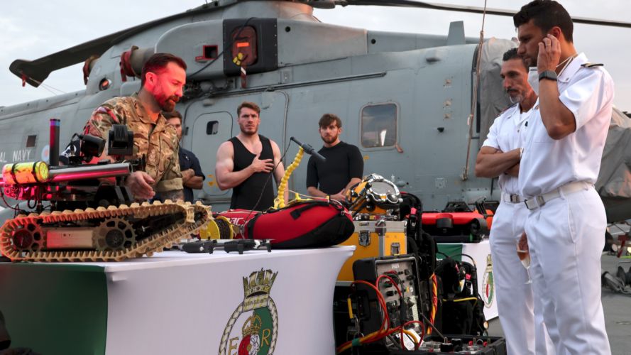 Divers on HMS Queen Elizabeth explain equipment to guests during a capability demonstration (Picture: MOD).
