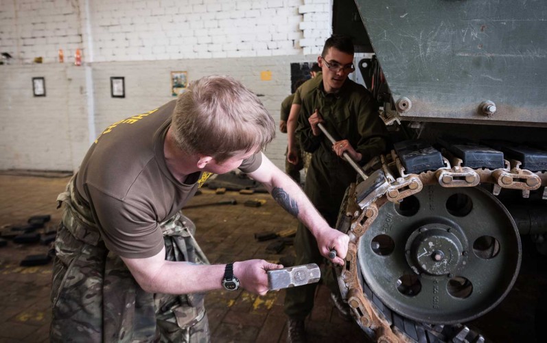 REME Mechanics Change Rubber Parts On An AS90 Track
