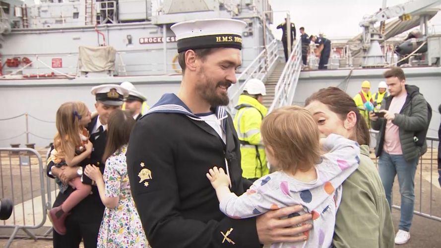 Naval families lined the jetty at HM Naval Base Portsmouth to welcome home HMS Brocklesby's crew, the first homecoming in two years. Families welcome home HMS Brocklesby's crew from the Gulf 081021 CREDIT BFBS.jpg