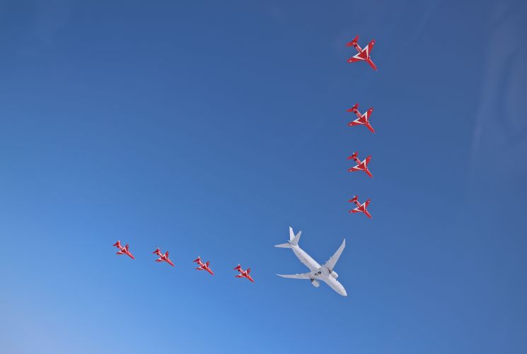 Flanked by the distinctive Hawk jets of the Royal Air Force Aerobatic Team, a Poseidon MRA1 (P-8A) Maritime Patrol aircraft carries out a flypast over Scotland (Picture: MOD).