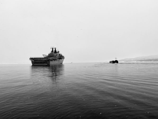 HMS Albion and a landing craft whilst deployed on NATO's Exercise Cold Response