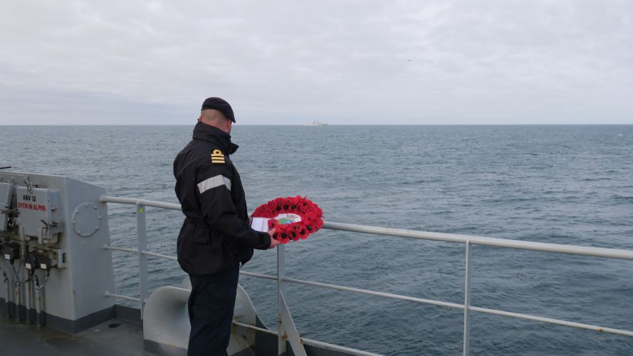 HMS Echo's Commander Coles prepares to cast wreath with the Marshal Ustinov a few hundred yards away 20092021 Credit Royal Navy.jpg