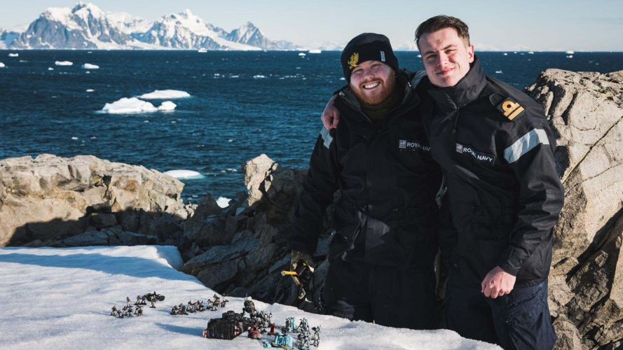 HMS Protector sailors Lts Jonny Talbor and Max Friswell with Warhammer pieces in the snow11022023 CREDIT Royal Navy.jpg