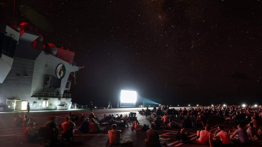 HMS Queen Elizabeth crew enjoyed a film night under the stars in September (Picture: HMS QE Twitter). HMS Queen Elizabeth crew enjoyed a film night under the stars in September 06092021 Credit HMS QE Twitter.jpeg
