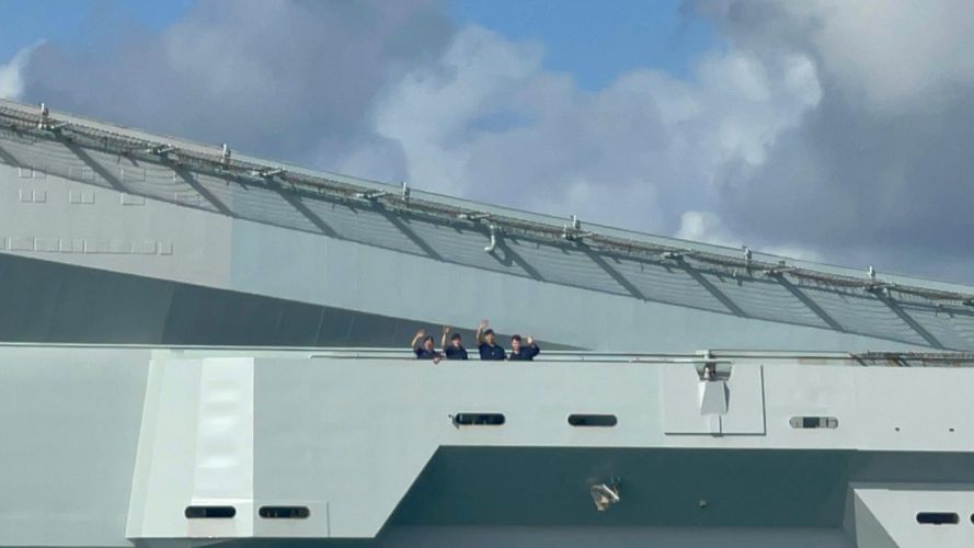HMS Queen Elizabeth crew say wave as they head for the USA 07092022 CREDIT BFBS.JPG 