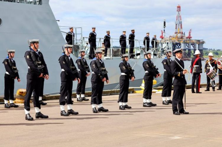 HMS Spey's guard stood at ease during the commissioning service for the vessel
