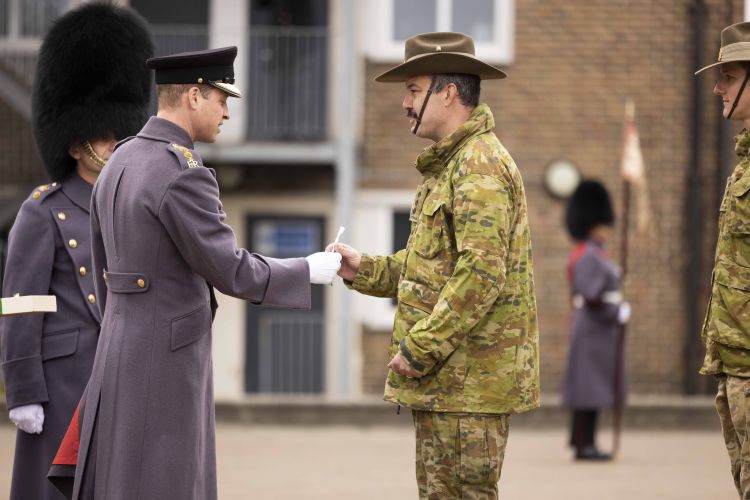 	HRH Prince of Wales presents members of the 5th Royal Australian Regiment (5RAR) of the Australian Army with handmade leeks at St David's Day celebration