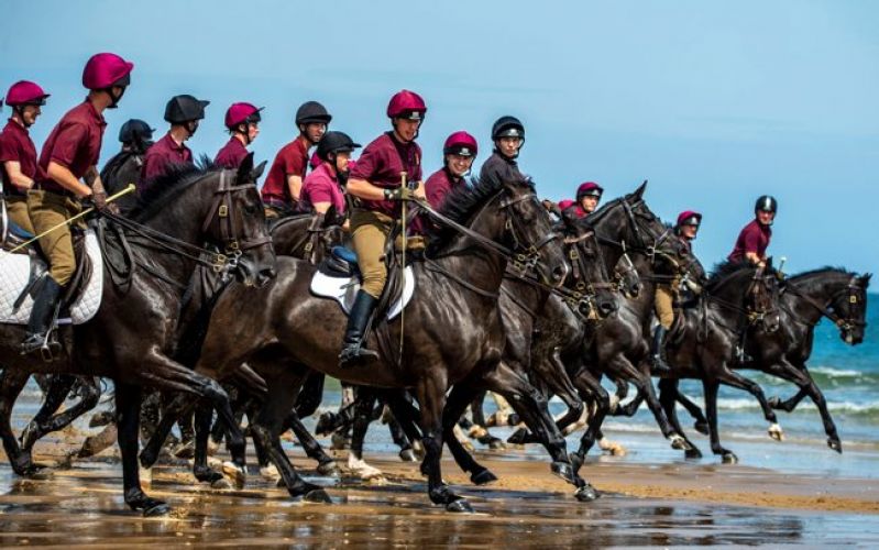 Household Cavalry on the beach in Norfolk closely 050719 Credit MOD
