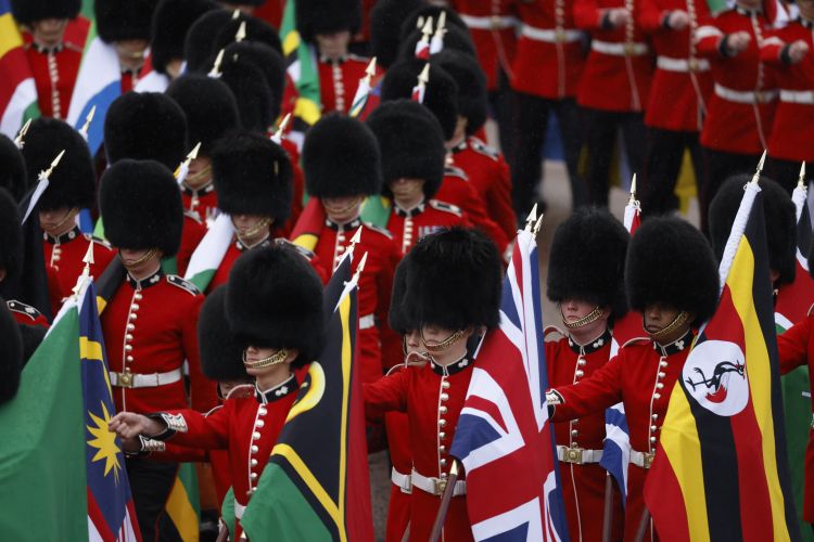 Household Division Guardsman carrying Commonwealth flags during the coronation 060523 CREDIT MOD.