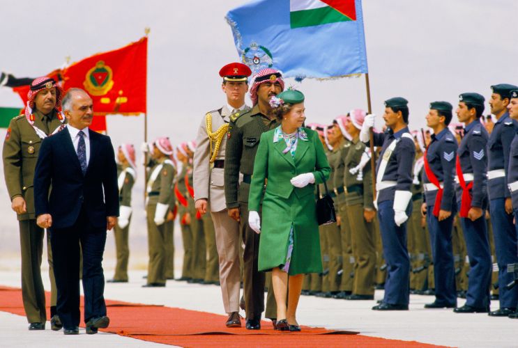 The Queen reviewing troops in Jordan with King Hussein in 1984 (Picture: Peter Jordan/Alamy Stock Photo). The Queen reviewing troops in Jordan with King Hussein in 1984 (Picture: Peter Jordan/Alamy Stock Photo).