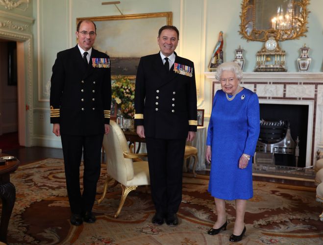 Queen Elizabeth II meeting the outgoing commanding officer of HMS Queen Elizabeth, Commordore Stephen Moorhouse (left) and his successor, Captain Angus Essenhigh, in 2020 (Picture: PA Images/Alamy Stock Photo). Queen Elizabeth II meeting the outgoing commanding officer of HMS Queen Elizabeth, Commordore Stephen Moorhouse (left) and his successor, Captain Angus Essenhigh in 2020 (Picture: PA Images/Alamy Stock Photo).
