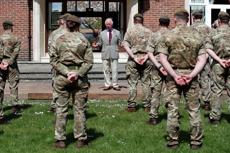 IMAGE ID 2FM160P Prince Charles addresses troops during visit to Welsh Guards at Combermere Barracks as regiment's colonel (Picture: Reuters/Peter Cziborra/Alamy Stock Photo).