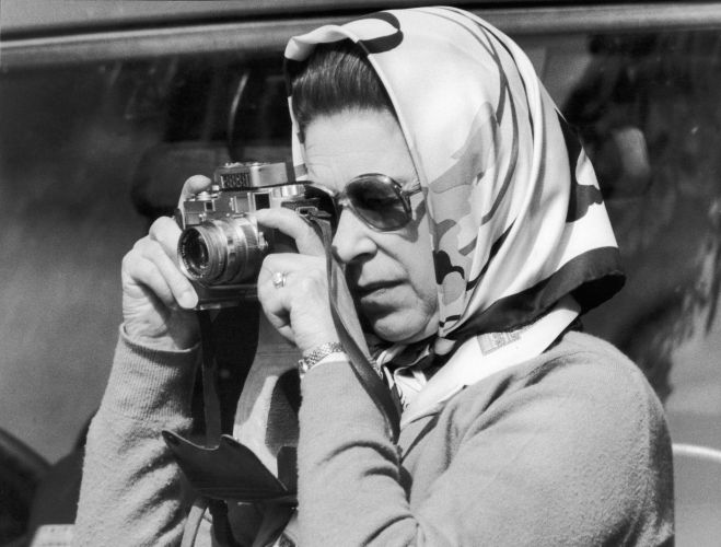 The Queen taking a photo during the Royal Windsor Horse Trials in May 1982 (Picture: Trinity Mirror/Mirrorpix/Alamy Stock Photo). The Queen taking a photo during the Royal Windsor Horse Trials in May 1982 (Picture: Trinity Mirror/Mirrorpix/Alamy Stock Photo).