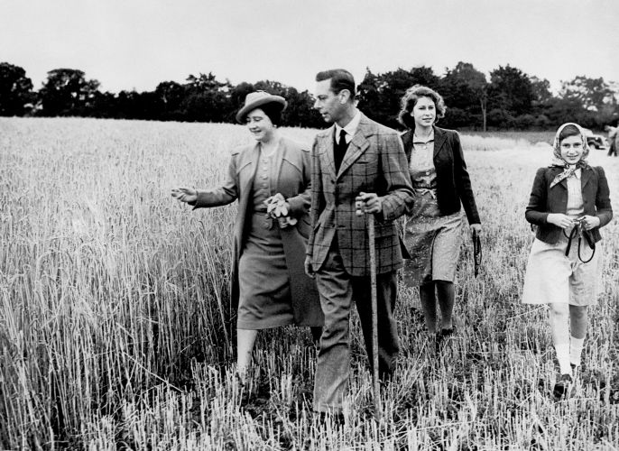 The then-Princess Elizabeth walking with her sister and parents during the Second World War (Picture: PA Images/Alamy Stock Photo). The then-Princess Elizabeth walking with her sister and parents during the Second World War (Picture: PA Images/Alamy Stock Photo).
