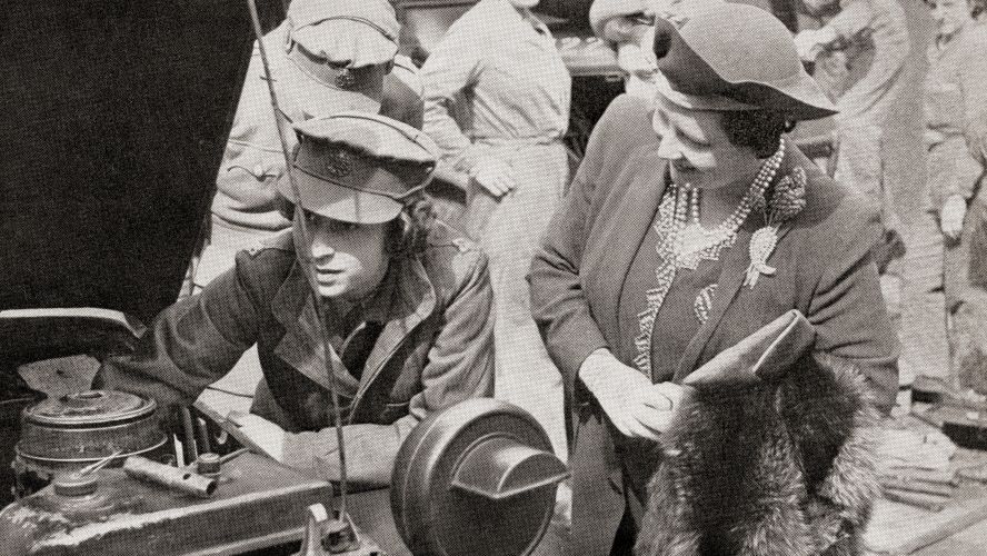 Princess Elizabeth works on a vehicle, with her mother watching on (Picture: Classic Image/Alamy Stock Photo). Princess Elizabeth works on a vehicle, with her mother watching on (Picture: Classic Image/Alamy Stock Photo).