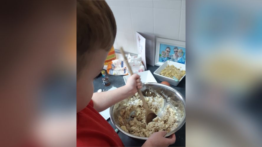 Child helping mummy bake