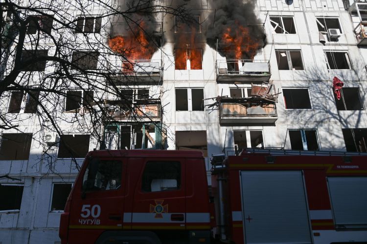 Firefighters arrive to an apartment in Chuhuiv, Ukraine, thought to have been damaged by Russian bombardment (Picture: