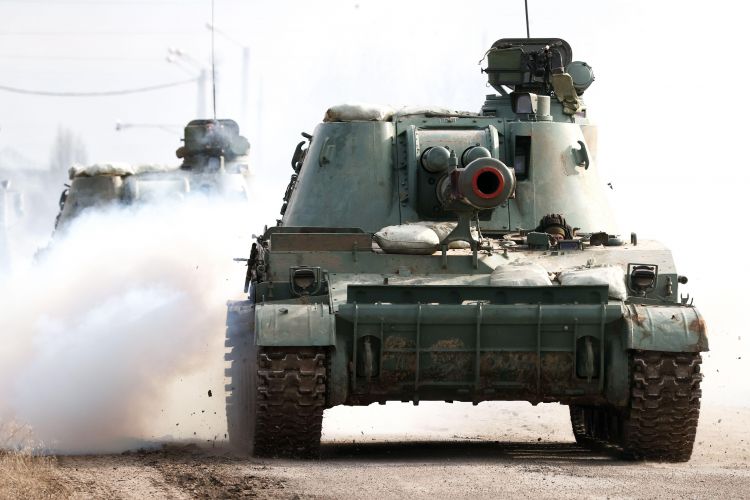 Armoured vehicles in Crimea approach Perekop checkpoint on Ukrainian border (Picture: Sergei Malgavko/TASS/ITAR-TASS News Agency/Alamy).