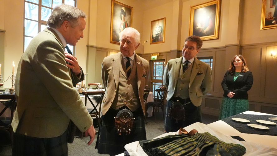 King Charles meets Alexander 'Sandy' Manson (left) as they view a kilt worn by Sandy's grandfather Captain Alexander Manson, during a visit to the Gordon Highlanders Museum CREDIT PA.jpg