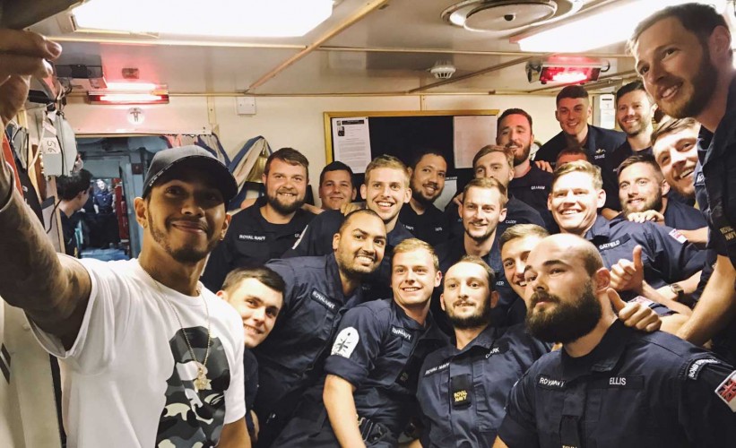 Lewis Hamilton takes a selfie with the crew of HMS Middleton