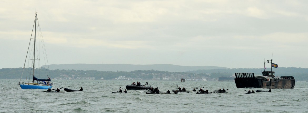 A team of 24 Royal Marines kayakers have arrived in Southsea after an epic paddle from France.
