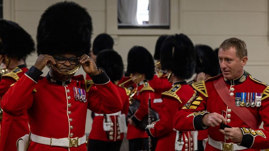 Members of the Household Division make final adjustments to uniform prior to a final dress rehearsal as a part of Operation London Bridge 13092022 CREDIT MOD Crown Copyright.jpg