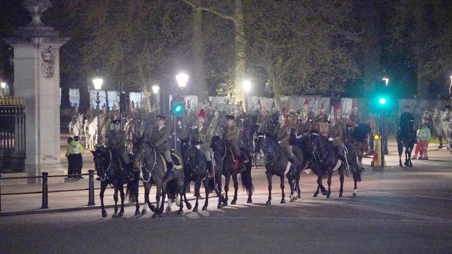 Members of the military on the Mall outside Buckingham Palace during a night time rehearsal for the coronation of King Charles 18042023 NO REUSE CREDIT PA WIRE, PA IMAGES.jpg