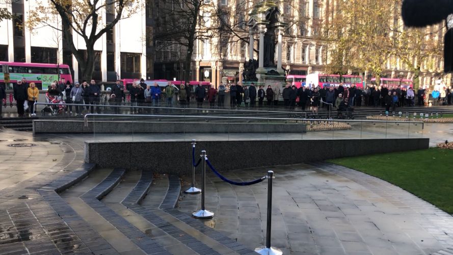 Members of the public gather for Armistice Day commemorations in Belfast.
