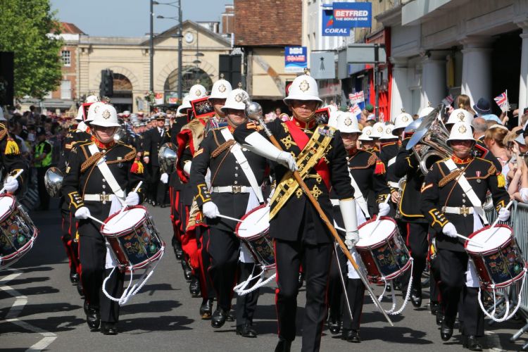 Military musicians parading through Salisbury Armed Forces Day
