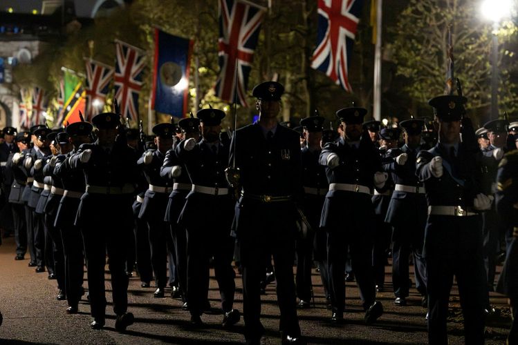 Military personnel carrying out the final full rehearsal of the Coronation at night in London
