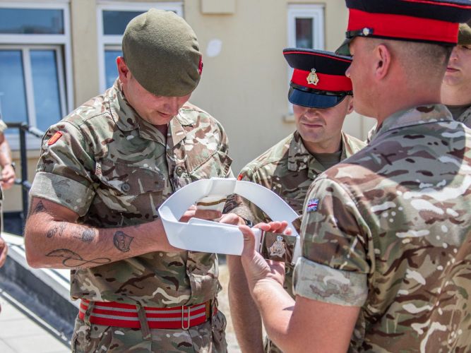 Military personnel inspect belt ahead of Queen's birthday rehearsal (Picture: MOD GIbraltar).