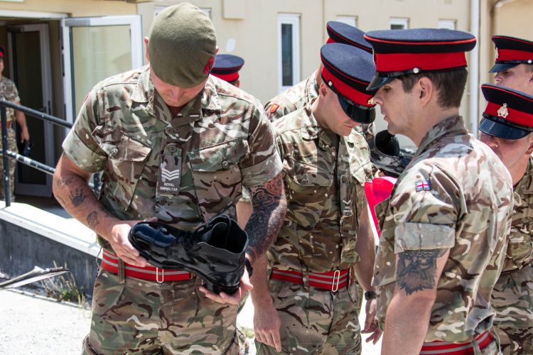 Military personnel inspect boots ahead of Queen's birthday rehearsal (Picture: MOD Gibraltar).