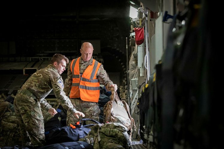 Military personnel working onboard the C-17 aircraft after landing at RAF Brize Norton, bringing troops back from Afghanistan who were deployed to help the UK's evacuation from Kabul airport (Picture: MOD).