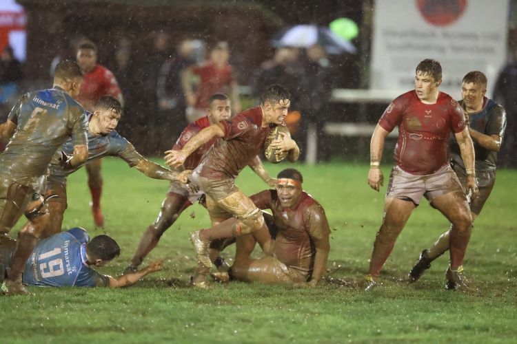Wet and muddy conditions made it tough for the players to get to the touchline 