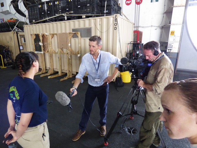 A mix of baking Arabian sun and jet fuel makes interviewing sweaty work.. 