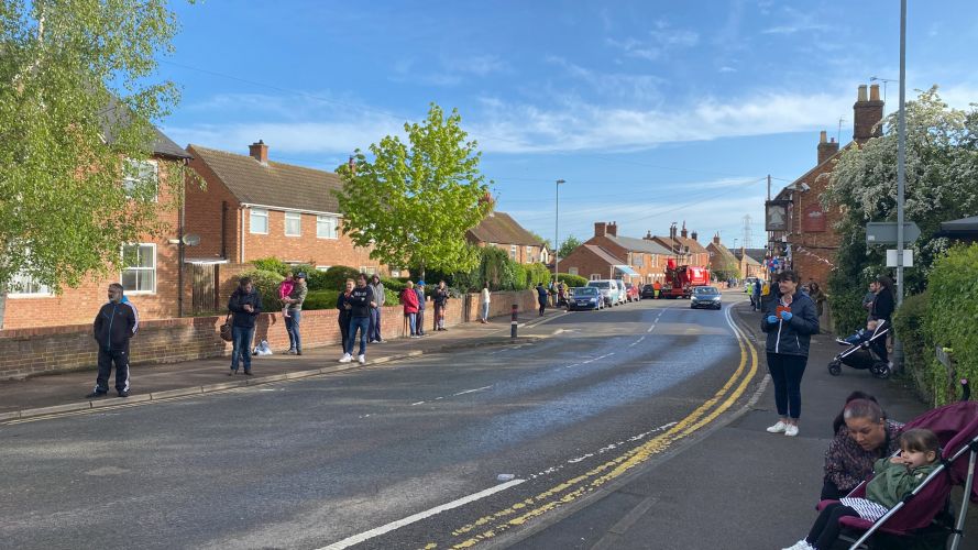 People in Captain Tom Moore's village sang happy birthday from outside their homes at a safe social distance.
